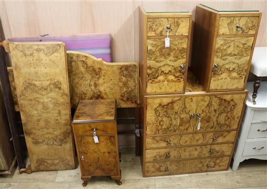 A walnut four-piece bedroom suite and a similar bedside cabinet